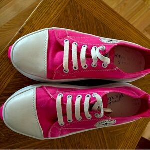 Bright pink tennis shoes